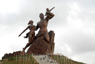 Illustration for article titled Africa's Statue of Liberty Is a Surreal Mix of Corruption and Sexism